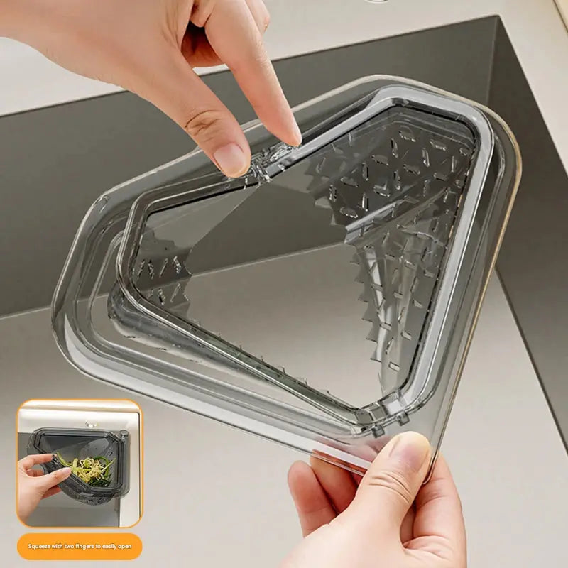 MCOIKY® Magnetic draining triangular kitchen sink filter for storing food scraps, leftovers, and kitchen waste.
